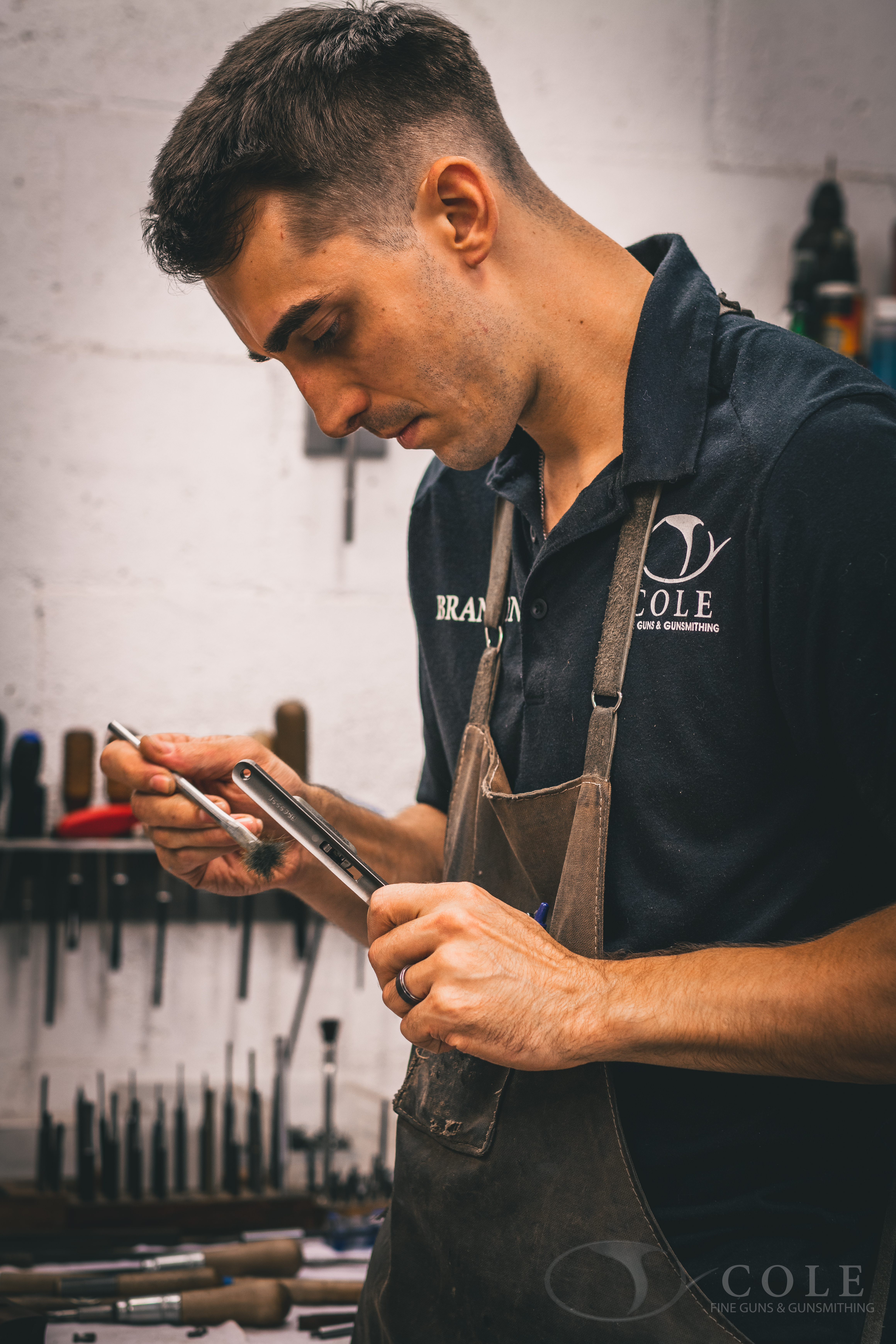 Image of gunsmith Brandon working on a Zoli shotgun