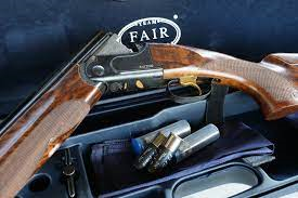 Image of a Fair Shotgun next to a blue carry case