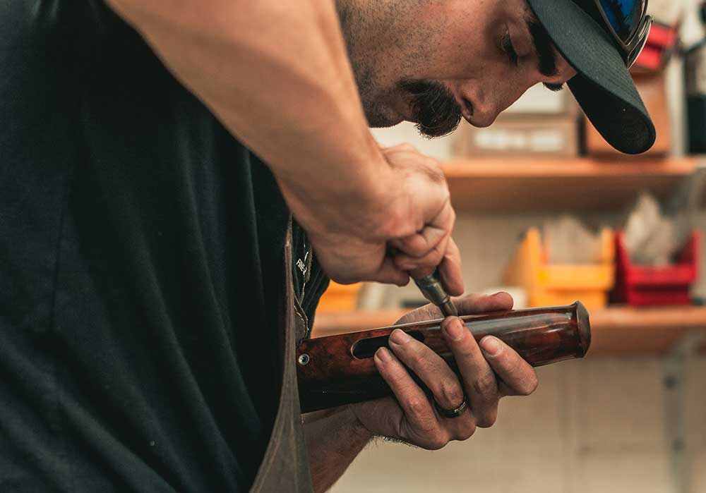 Brandon, Gunsmith at Cole Fine Guns, fitting forend | Gunsmithing Services