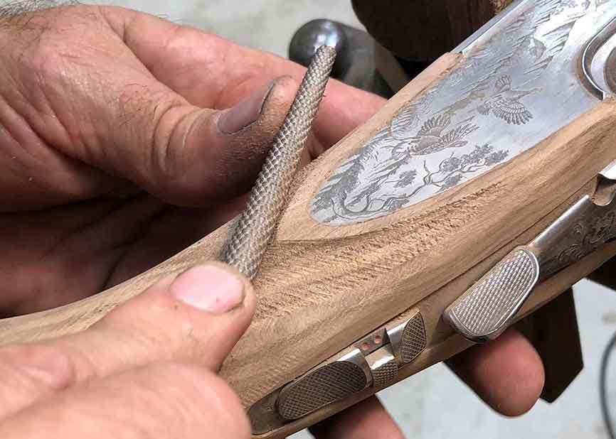 Hand carving of a custom shotgun stock in progress | Cole Fine Guns and Gunsmithing